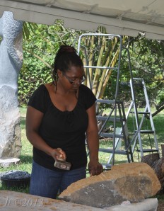 Agnes Nyanhongo, creating a sculpture at the Chapungu Exhibit, Fairchild Tropical Gardens
